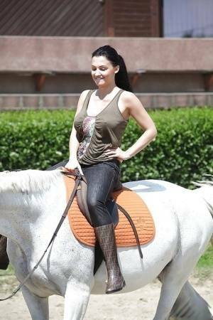 Pornstar Aletta Ocean is riding a horse outdoor in glasses on tubephoto.pics