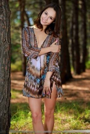 Sweet teen with an ass to die for disrobes for great nude poses in a forest on tubephoto.pics