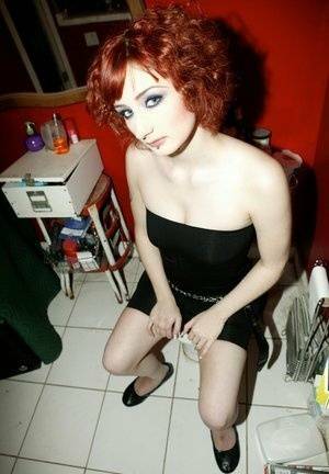 Pale redhead Violet Monroe gets naked in flat shoes while in a bathroom on tubephoto.pics