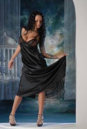 Leggy Latina chick Angelina Valentine removes a long black dress to pose nude on tubephoto.pics