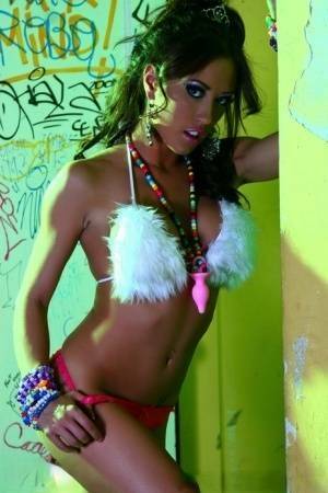 Hot MILF Capri Cavanni peels off her bikini amid graffiti in furry boots on tubephoto.pics