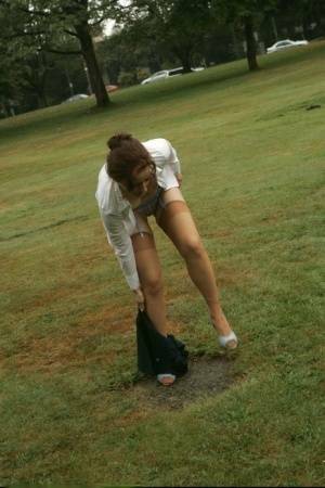 Amateur chick Dirty Angie strips to her pretties and tan nylons in a park on tubephoto.pics