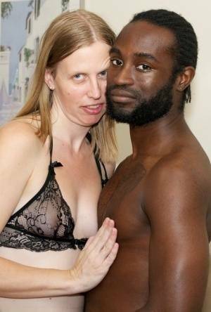 White amateur deepthroats her black lover's cock in lingerie ensemble on tubephoto.pics