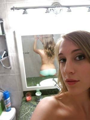 Smiley amateur Cadence Lux stripping and picturing herself in the bath on tubephoto.pics