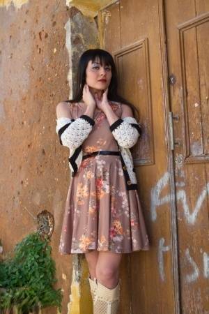Asian model Sophia Jade flashes her upskirt panties on a cobblestone street on tubephoto.pics