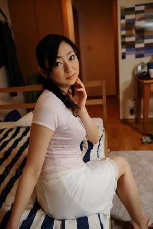 Slender mature Japanese woman Emiko Koike bends over to pose in white dress - Japan on tubephoto.pics