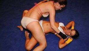 Adorable lesbians are into hot nude wrestling in the ring on tubephoto.pics